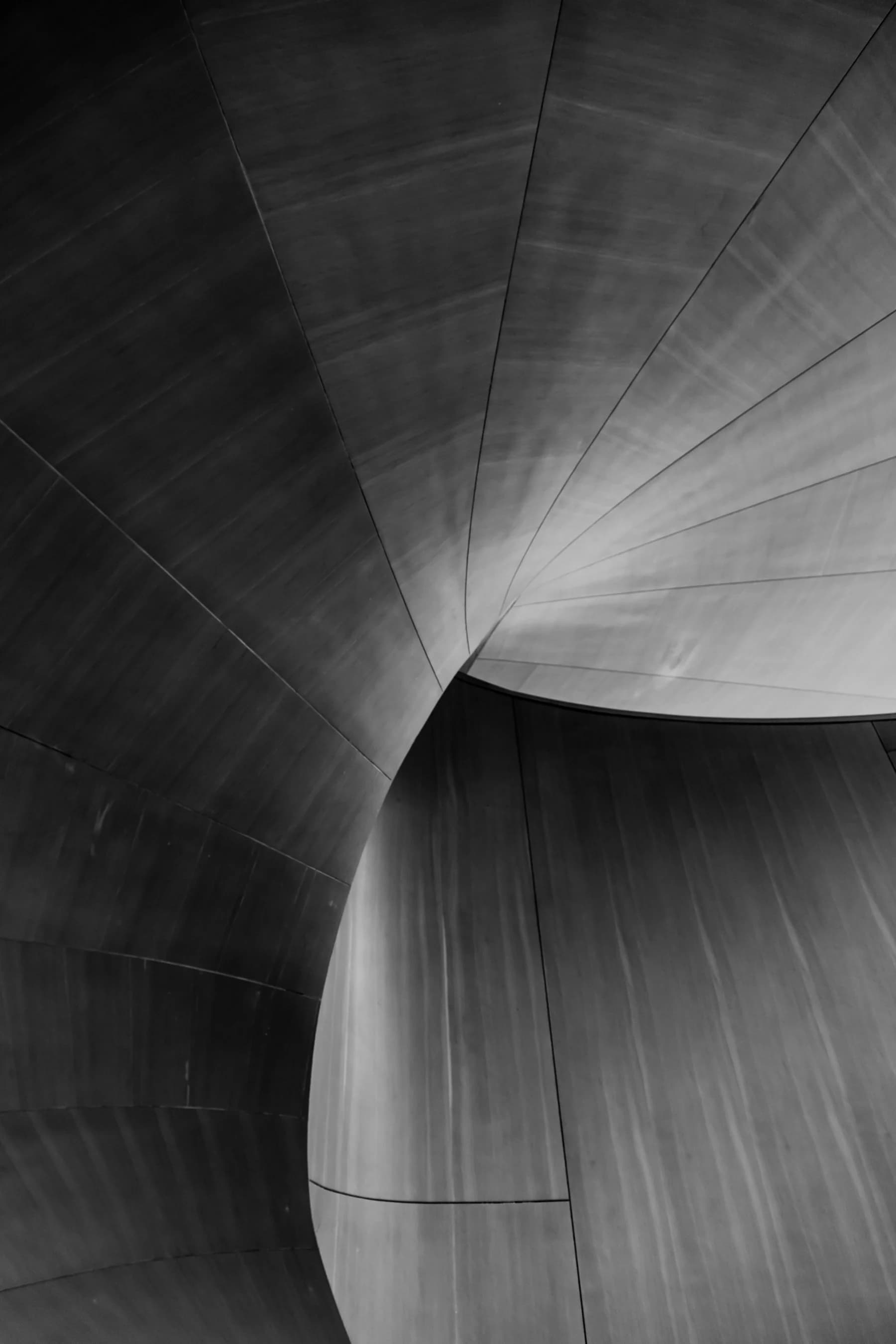 Light tracing the continuous curve of a folded architectural wall
